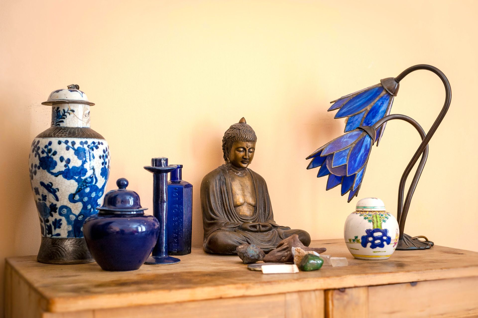 A picture of a ceramic Buddha on a desk at The Whole Works Complementary Therapy and Counselling Centre Building